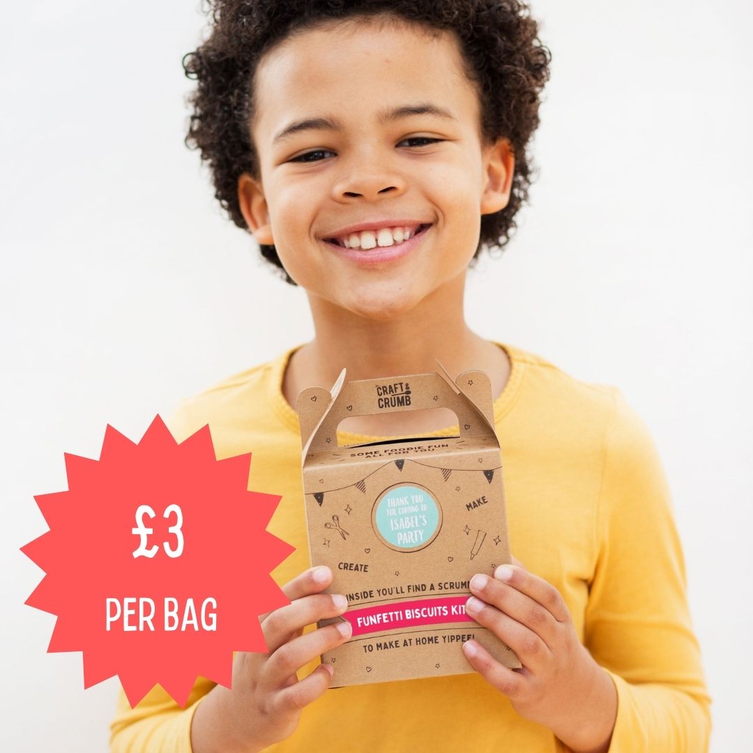Child holding a Craft & Crumb Funfetti Biscuits Kit with a price tag of £3 per bag, wearing a yellow shirt, promoting baking kits for kids in the UK.