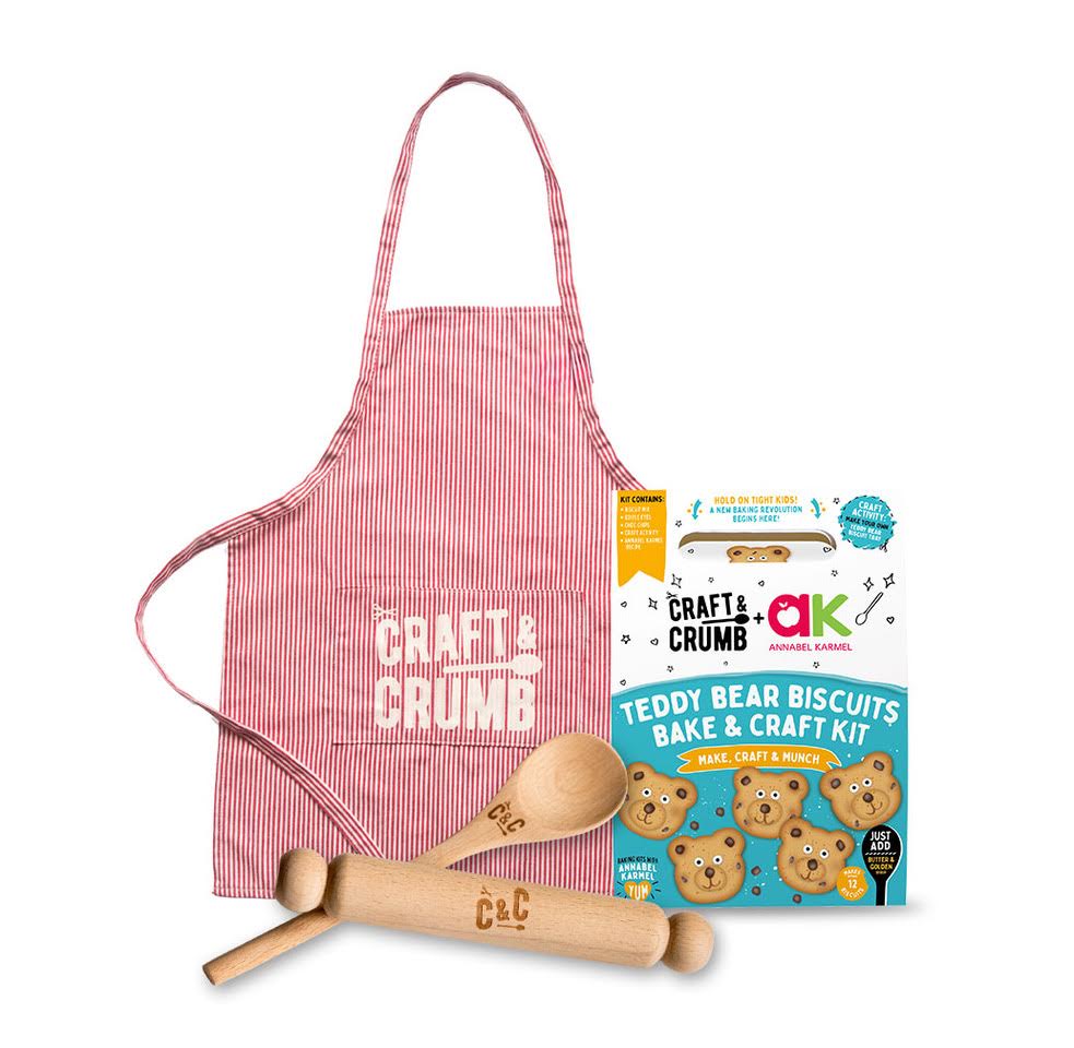 Teddy bear biscuit kit with apron and rolling pins, featuring Craft & Crumb branding.