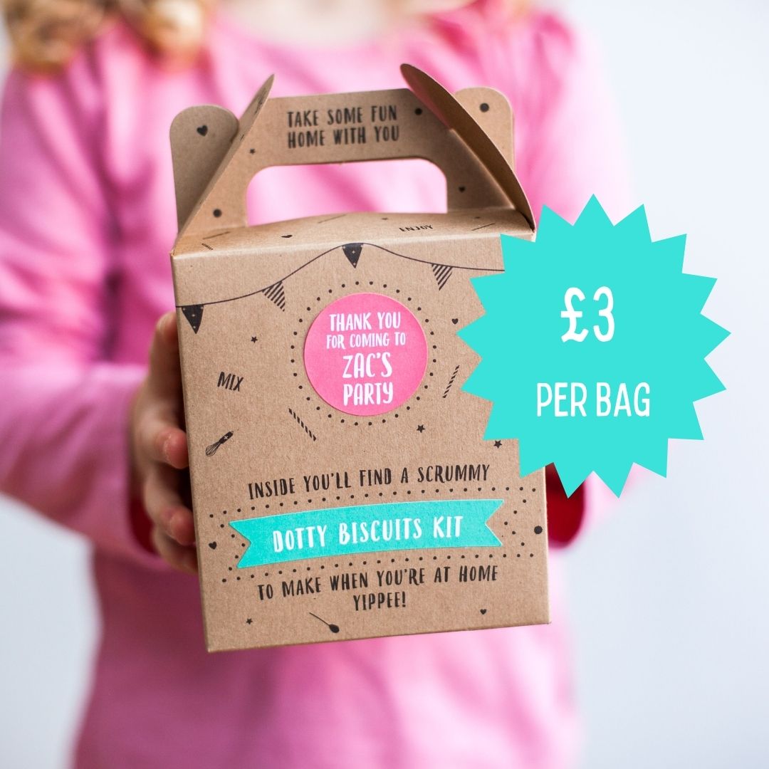 Child holding a brown box with "Dotty Biscuits Kit" and a teal starburst showing "£3 per bag" in pink and teal text.