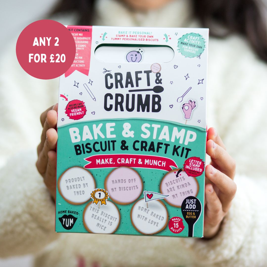 Person holding a "Craft & Crumb" Bake & Stamp Biscuit & Craft Kit with a "Any 2 for £20" offer.