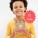 Child holding a funfetti biscuits kit box with a red starburst showing "£3 per bag" price.