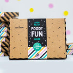 Craft & Crumb box with "Foody Fun Inside" label, colorful stripes, and polka dots on a light background.